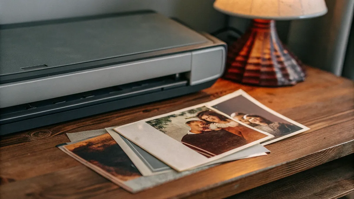 Scanner digitizing vintage family documents and photographs for genealogy preservation